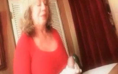 Grandmother with big tits gives a handjob while talking dirty